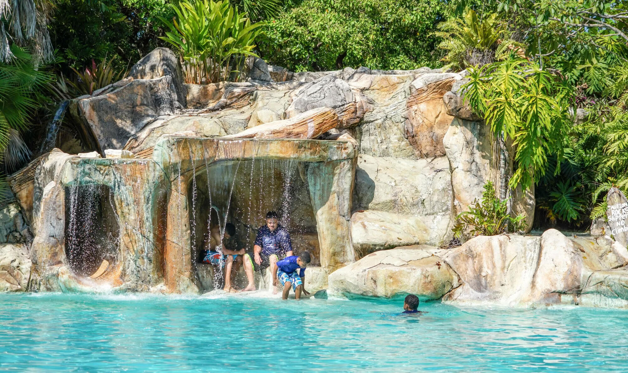 Pool Waterfalls and Grottos: Adding Drama to Your Oasis